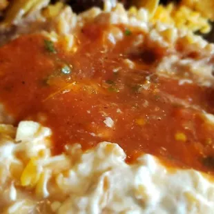 The rice and beans mixed up and topped with salsa