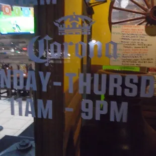 Hours of operation, front entry door.