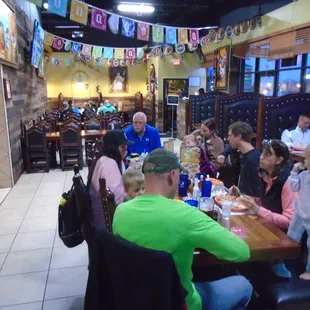 A shot of the main dining room from the opposite side, looking towards the front door.