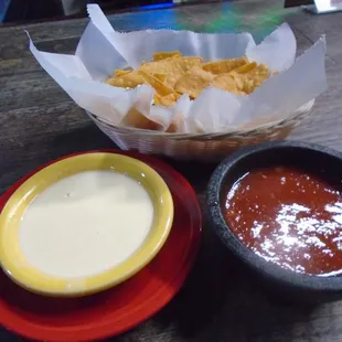 Complimentary corn chips with queso blanco and salsa.