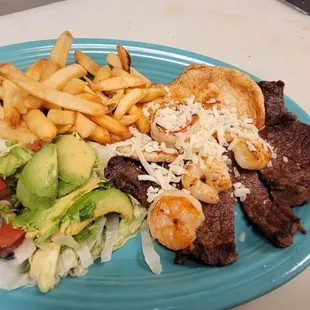EL TRIO 
grilled chicken breast, ribeye steak ,grilled shrimp, French fries, and avocado salad