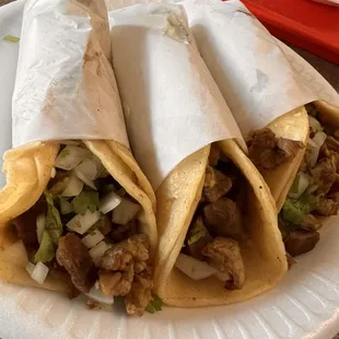 two burritos on a paper plate