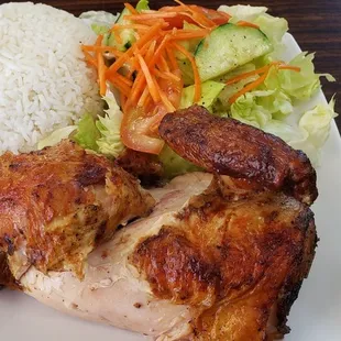 Half chicken, rice and salad