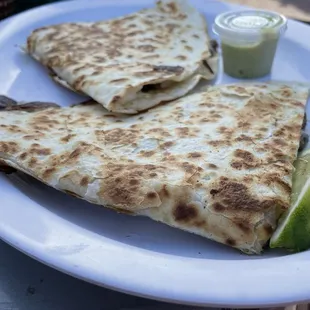 Carnitas Quesadilla with spicy jalapeño sauce &amp; lime
