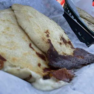 Pupusas Queso (front) and Pupusas Chicharron y queso
