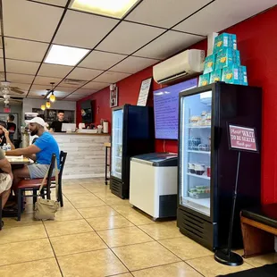 people sitting at a table in a restaurant
