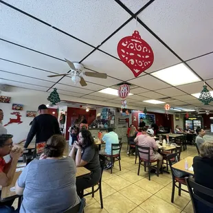 people eating at tables in a restaurant