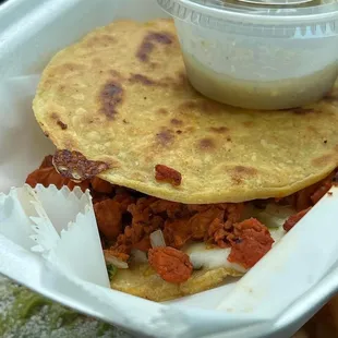 Chicken al pastor Mulita. The green sauce is incredible too!!