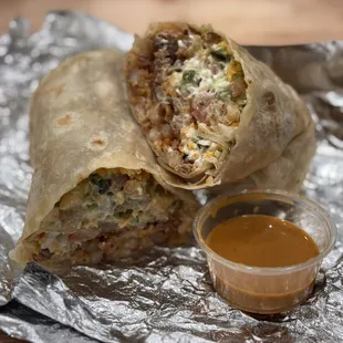 california burrito with pork and a side of habanero sauce