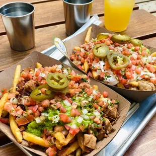 Sisig fries with chicken and vegan sisig fries with vegan chicken. They look the same and taste both amazing!