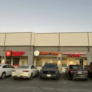cars parked in front of store