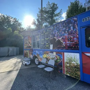 Outside the food truck in the parking lot of the Sunoco