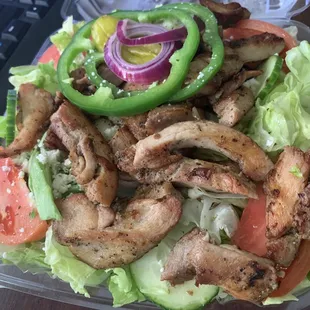 a salad in a styrofoam container