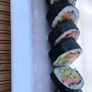 a sushi with salmon and avocado