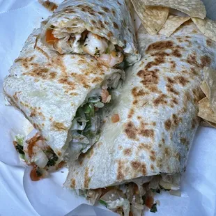 a tortilla and chips on a paper plate