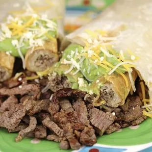 Poco Loco Burro! Born here... 2 Rolled Tacos, Guac, Cheese &amp; Carne Asada.