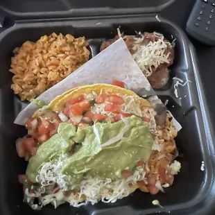 Softshell Carne Asada Taco w guacamole, beans, and rice.