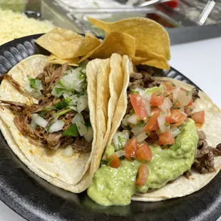 Carnitas and carne asada taco