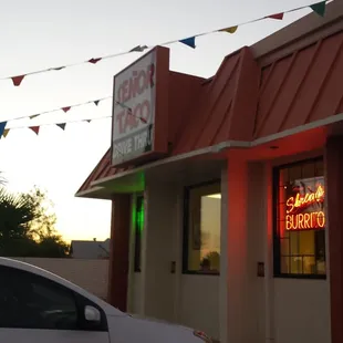 Building blocked by tacky Del Webb sign.