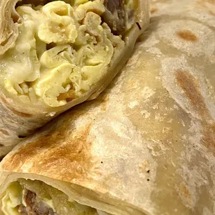 Create Your Own Breakfast Burrito with egg, sausage, hash-brown, cheese, and green enchilada sauce added