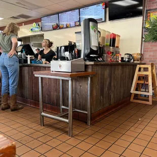 a woman standing at a counter