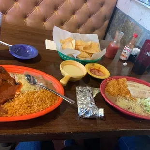 Chimichanga, ranchero steak, chips and cheese, beans and rice