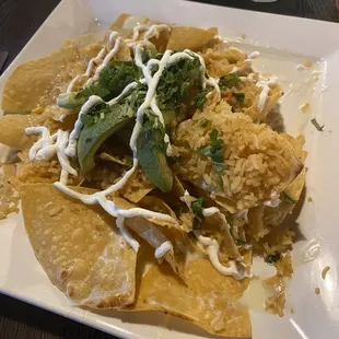 Ordered the cheese nachos add rice, cilantro and avocado.  Chips were very dry, paid additional for more cheese.  5/10