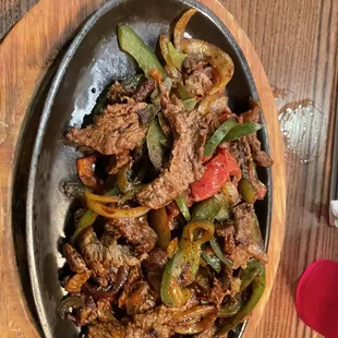 a bowl of beef and peppers
