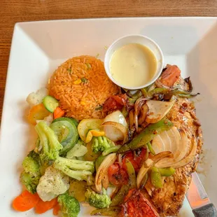 Pollo loco with rice, vegetables and cheese sauce