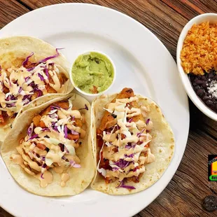 a plate of tacos and rice