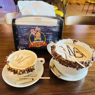 two cups of coffee on a table