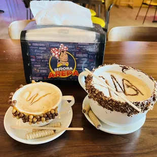 two cups of coffee on a table