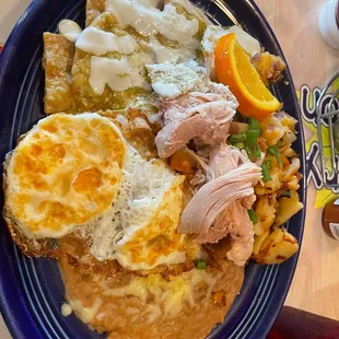 Green chilaquiles with chicken. The chicken doesn't look that great in the photo lol but it was okay! Could have gone without it tbh!