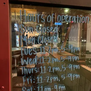 a sign in the window of a restaurant
