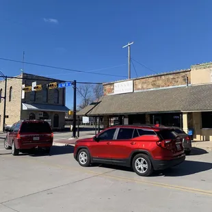 two cars parked in a parking lot