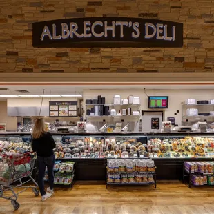 a woman shopping in a deli