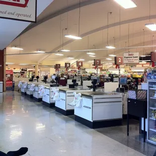 a man sitting on a bench in a grocery store