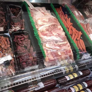Meat case + some of their own smoked creations!