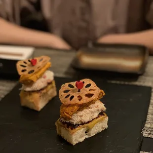 a person sitting at a table with a plate of food