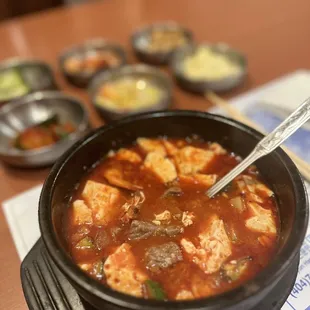 a bowl of soup with a spoon in it