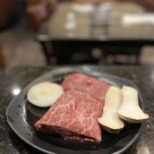 a plate of meat and vegetables