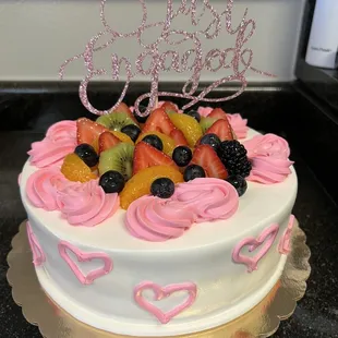 White cake with fruit, custom ordered pink hearts