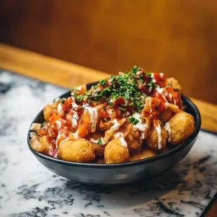 a bowl of fried tater tots