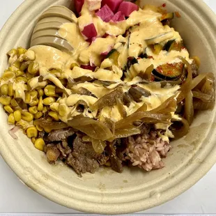 Bulgogi bowl w/ egg, corn, pickled daikon, kimchi cucumber, grilled onions, and yum yum sauce