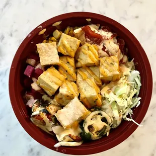 Tofu bowl with white rice and almost all the toppings. Those jalapeños were spicy! Great bowl!