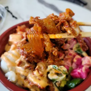 Japchae bowl with spicy pork.