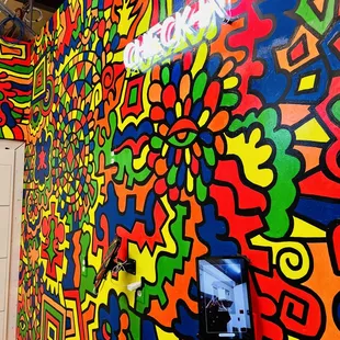 a brightly colored mural in a hallway