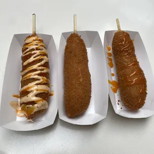 Left to right  #12 mozzarella half sausage w/ spicy ranch + spicy cheddar sauce  #20 mozzarella plain #16 sausage with cheddar sauce