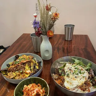 Bibimbap with chicken and shiitake mushrooms, cabbage kimchi, kimchi japchae