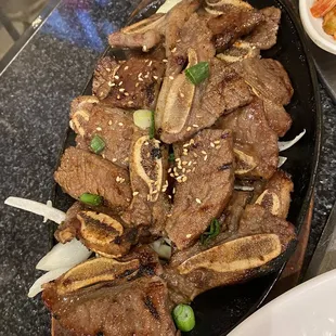 a platter of beef and vegetables